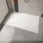 Curbless SMC Shower Base with Flamed Rock Slip-Resistant Surface, Reversible Drain