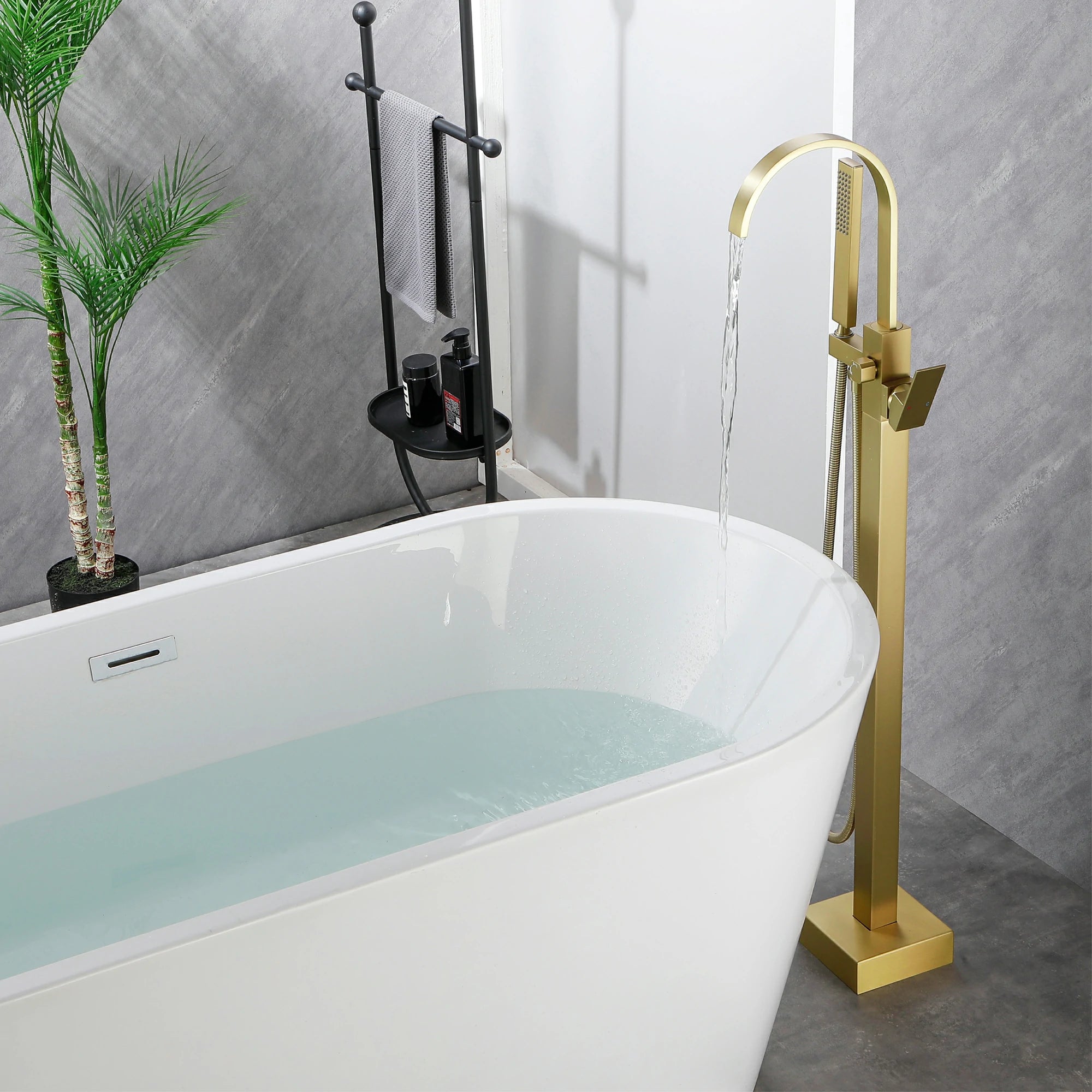 360° Swivel Waterfall Freestanding Bathtub Faucet with Hand Shower in Brushed Gold