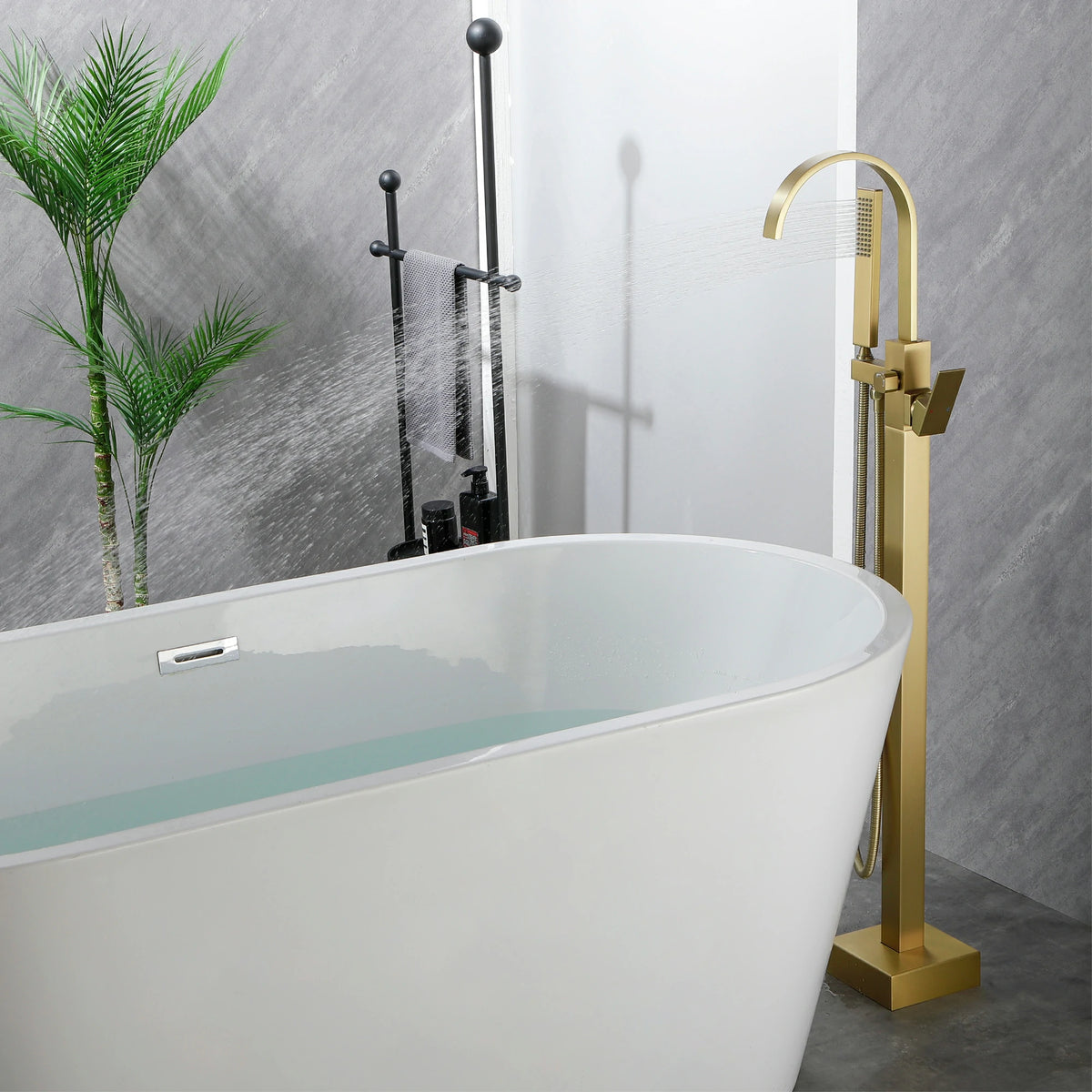 360° Swivel Waterfall Freestanding Bathtub Faucet with Hand Shower in Brushed Gold