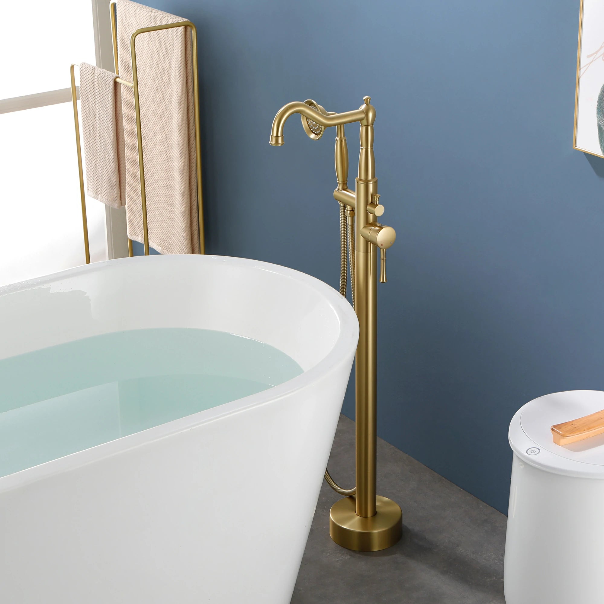 360° Swivel Waterfall Freestanding Bathtub Faucet with Hand Shower in Brushed Gold