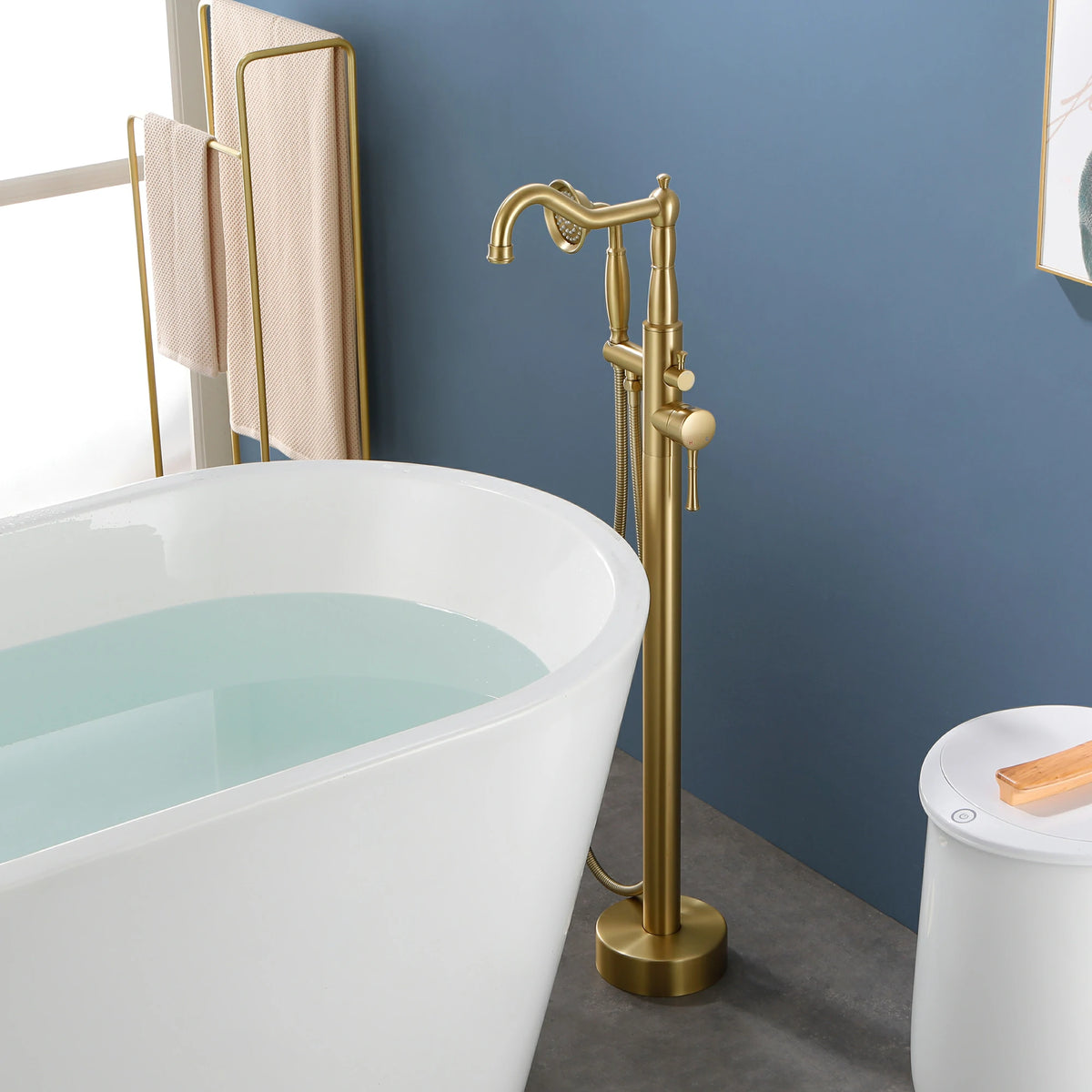 360° Swivel Waterfall Freestanding Bathtub Faucet with Hand Shower in Brushed Gold