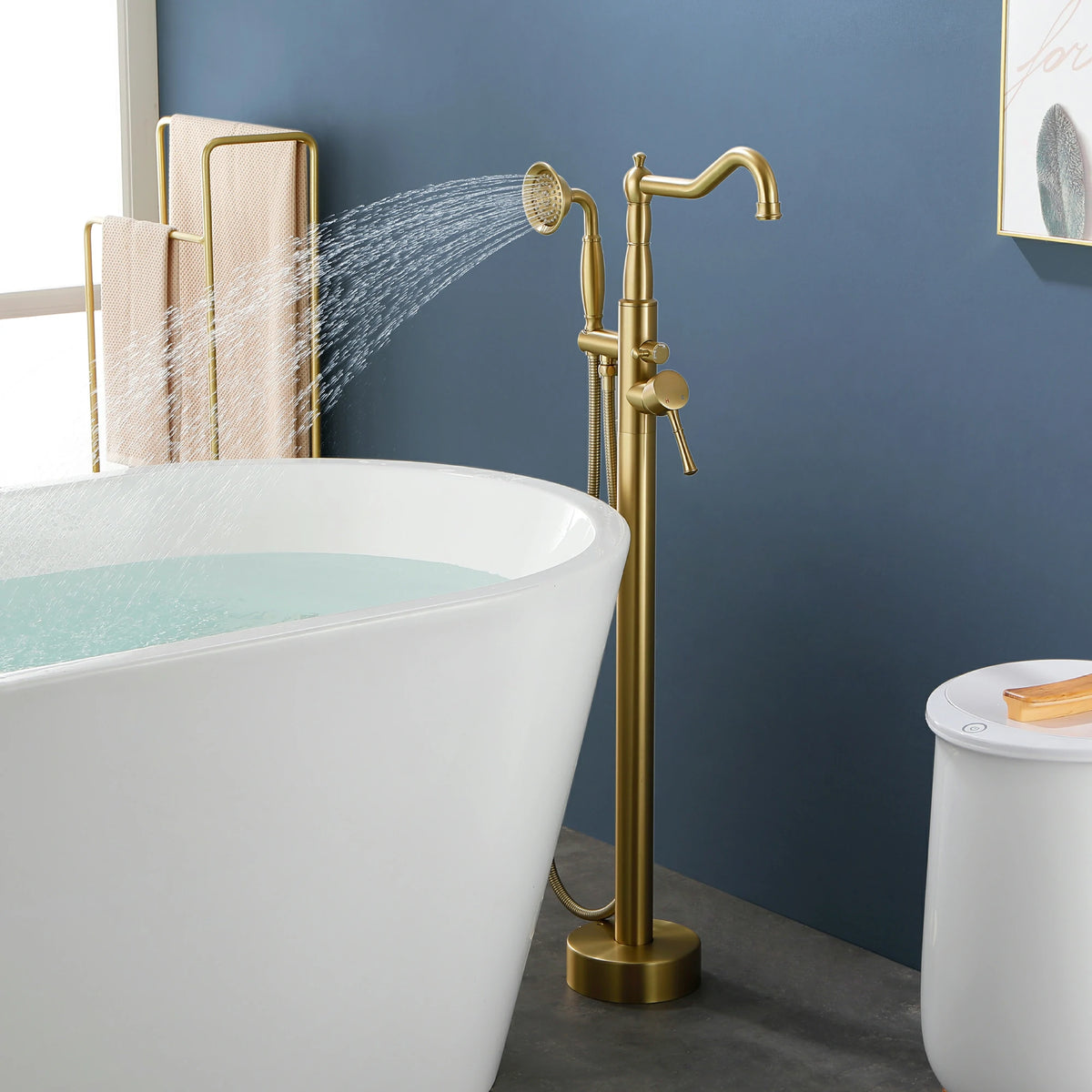 360° Swivel Waterfall Freestanding Bathtub Faucet with Hand Shower in Brushed Gold