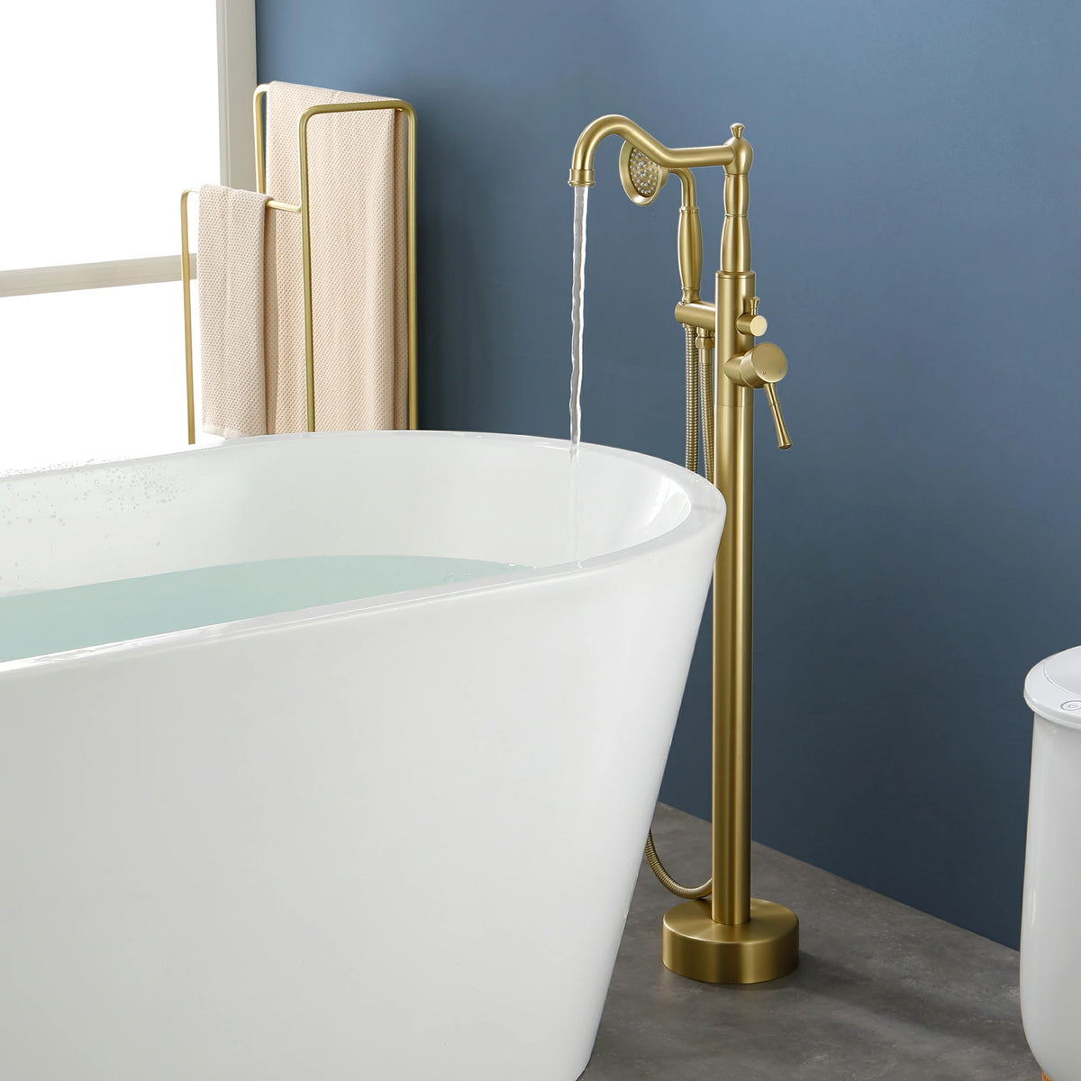 360° Swivel Waterfall Freestanding Bathtub Faucet with Hand Shower in Brushed Gold