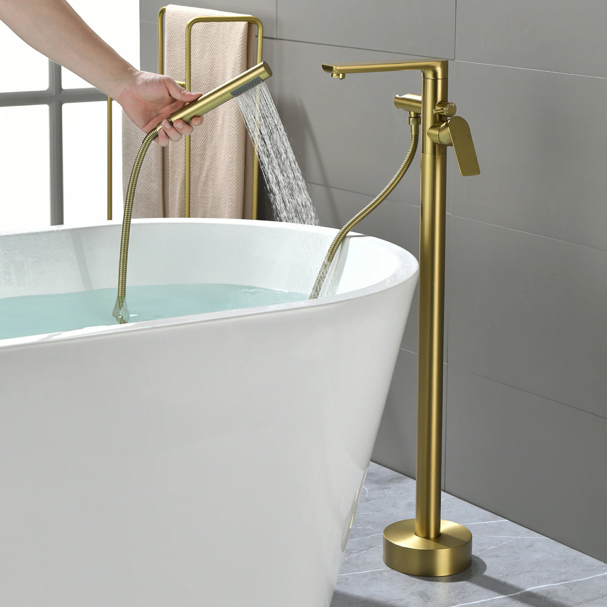 360° Swivel Aerated Spout Freestanding Bathtub Faucet with Hand Shower in Brushed Gold