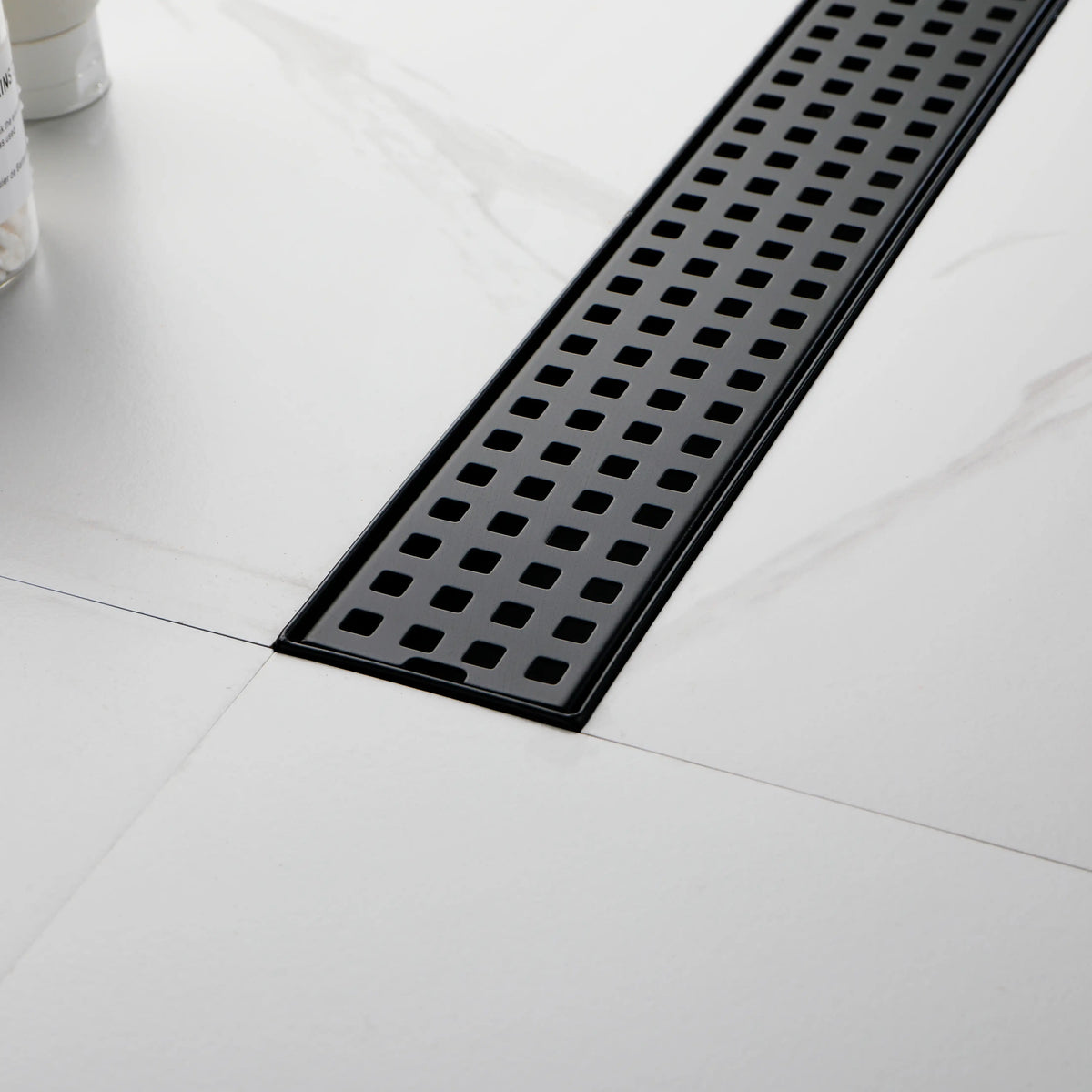 24 Inch Linear Shower Drain in 304 Stainless Steel with Removable Patterned Grate Hair Strainer and Leveling Feet