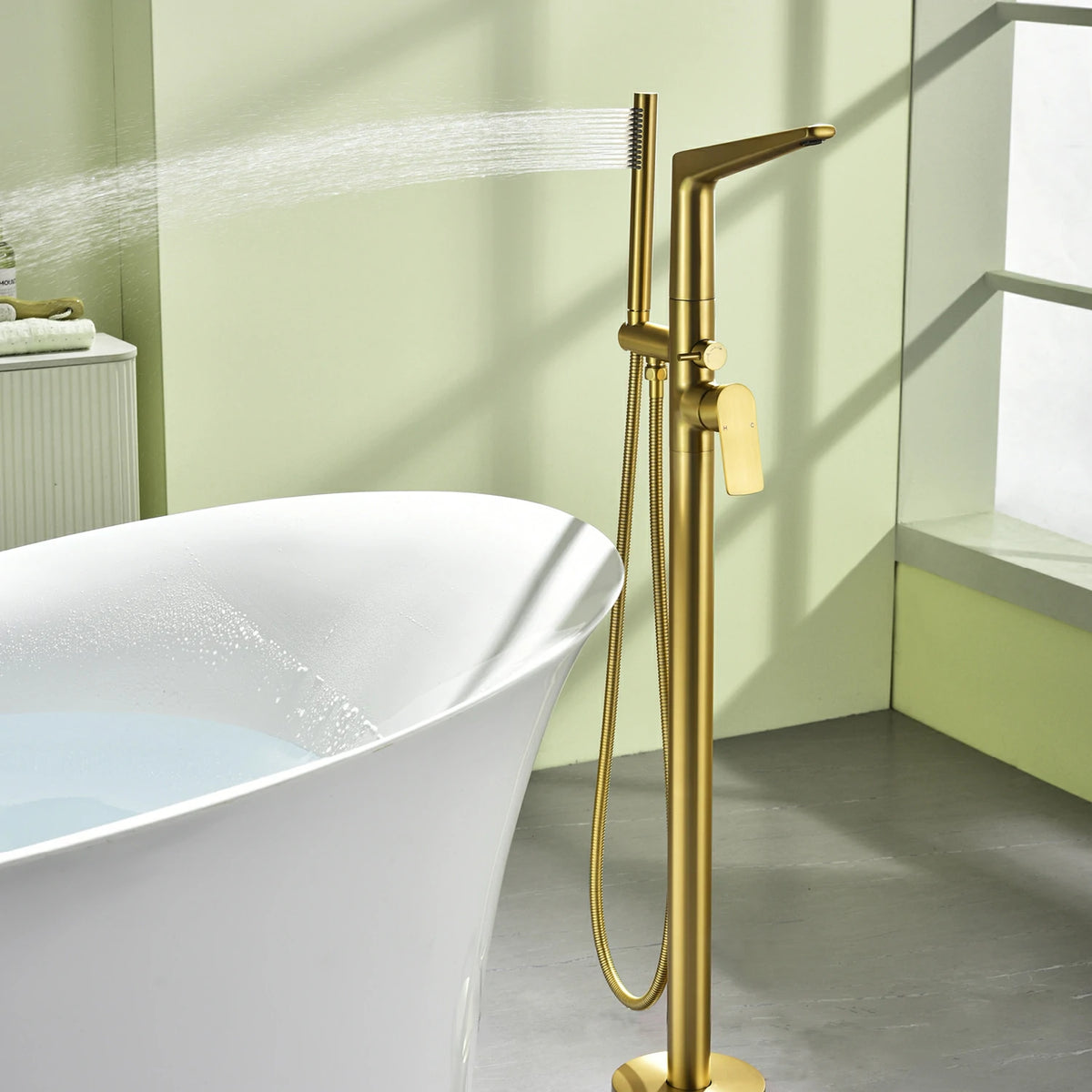 One-Piece Brass Waterfall Freestanding Bathtub Faucet with Hand Shower in Brushed Gold