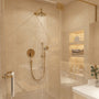 Modern bathroom with gold shower head and fixtures